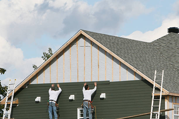 Professional Siding Installation technician working in Henderson, MD